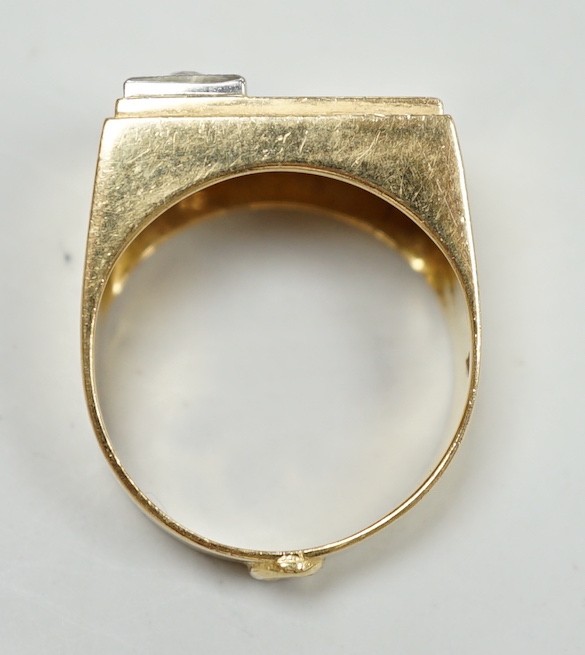 A 750 yellow metal and single stone diamond set signet ring, size Q/R, gross weight 10 grams.